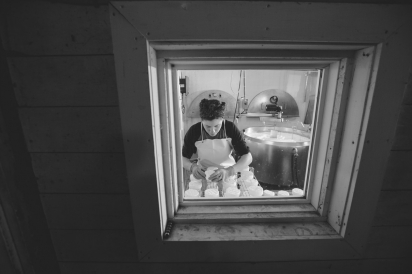 This was shot from inside the barn looking through to Margot flipping cheese in her creamery.