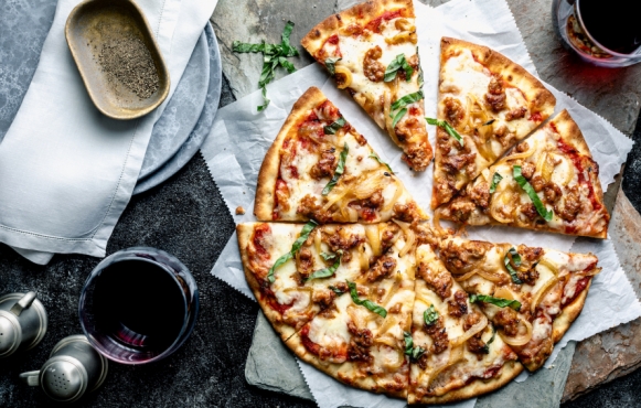 Quick and easy recipe for Sausage and Caramelized Onion Pizza.